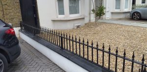 short wrought iron garden wall railing with posts