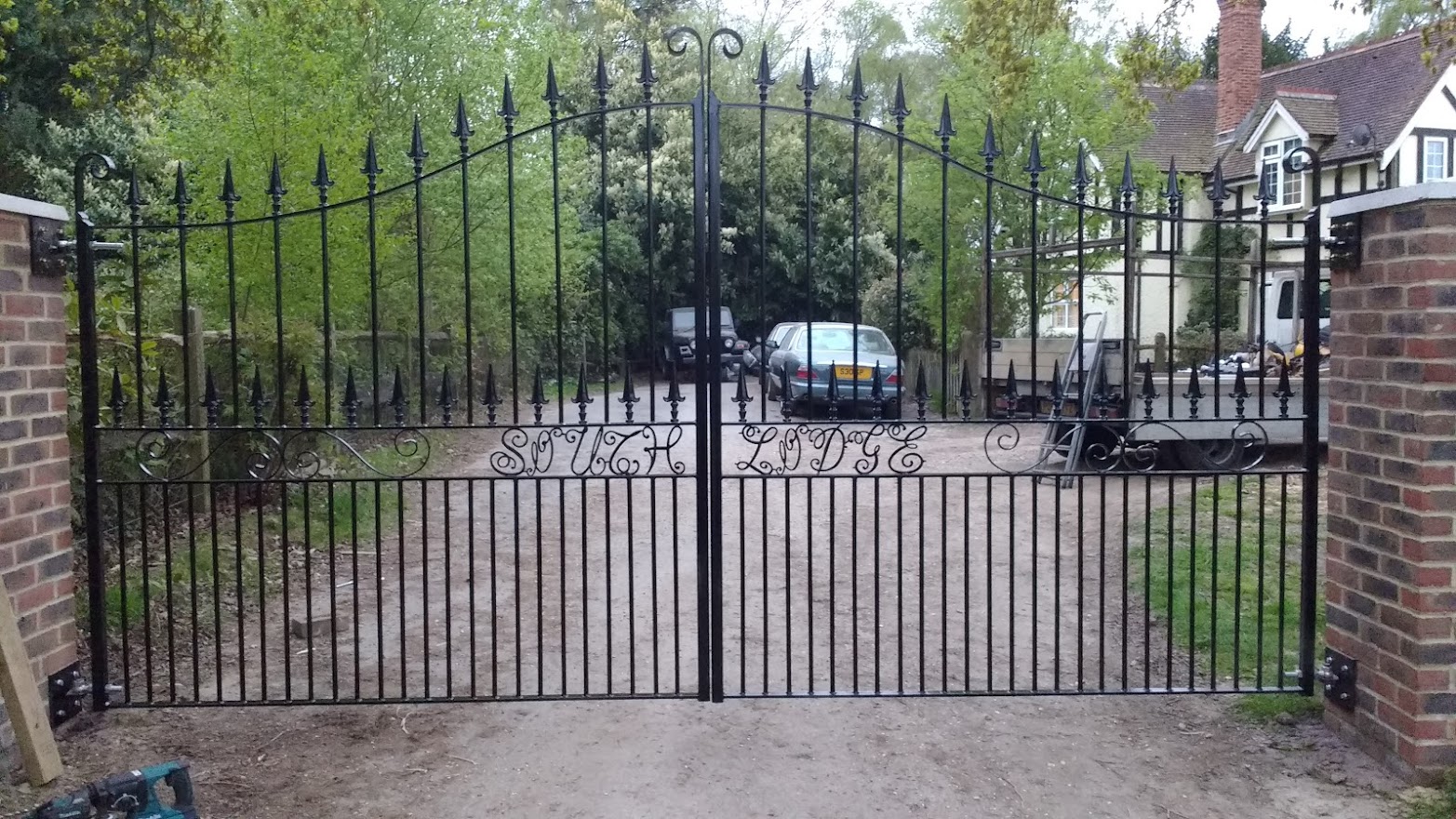 Decorative wrought iron gates with arch