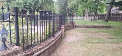 curved iron railings on wall