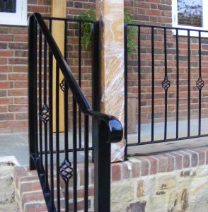 Handrail down steeps as part of raised patio area railings