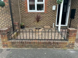 hoop railing on a low wall in Crawley.