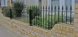 Wall railings following the contour of a shaped wall